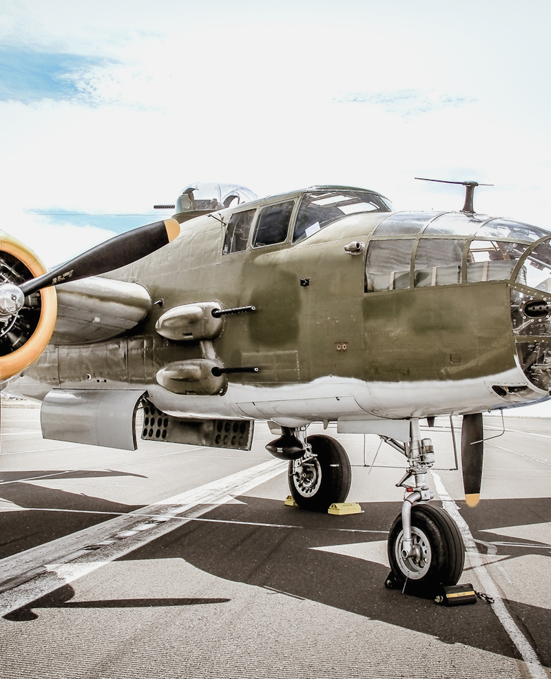 Vintage military aircraft on display at airfield.